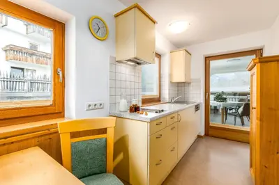 a kitchen with a sink and a counter top at Formsunhof in Siusi