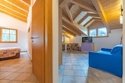 a large living room with a couch and a table at Casa dei Caprioli in Pera