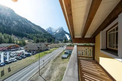 a balcony with a view of a street and mountains at Casa dei Caprioli in Pera