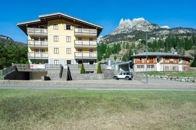 a building with a car parked in front of it at Casa dei Caprioli in Pera
