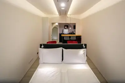 a room with a bed with two white pillows at Apartment Bolzano in Bolzano