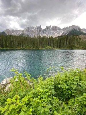 a view of a lake with mountains in the background at Apartment Kesselkogel - Rosenheim Apartments in Tires
