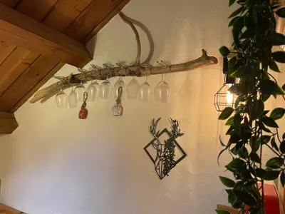 a group of glass bottles hanging on a wall at Splendida Carezza in Carezza al Lago