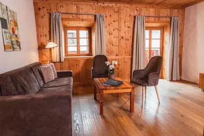 a living room with a couch and chairs and a table at Huberhof in Naz-Sciaves