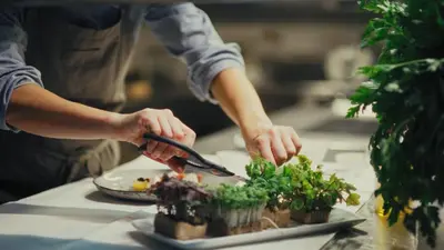 a person preparing a plate of food with potted plants at Alma Apartments in Luson