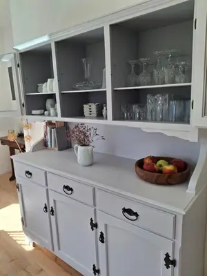 a white cabinet with a bowl of fruit on it at Haus Hafner Sonniges Apartment in Terlano