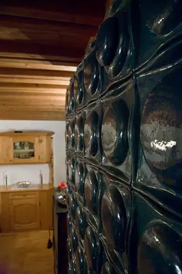 a large green glass wall in a kitchen at I cuori in Cortina dʼAmpezzo
