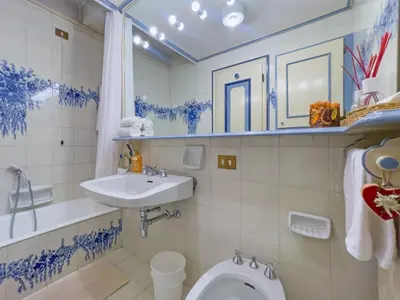 a bathroom with a toilet and a sink at I cuori in Cortina dʼAmpezzo