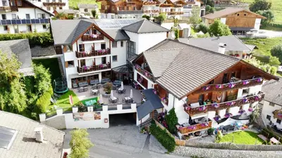 an aerial view of a house in a village at Hotel Tonnerhof in Racines