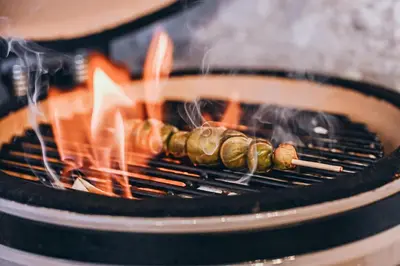 a bunch of food cooking on a grill at Wolter Landhaus in Vipiteno