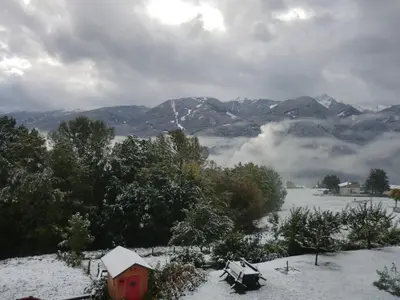 a view of a snow covered valley with mountains at Casa Erica - Carano in Carano