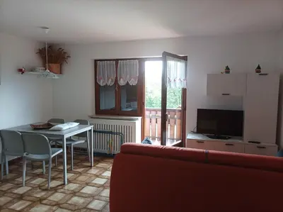 a living room with a couch and a table at Casa Erica - Carano in Carano