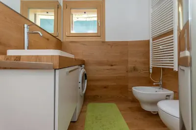 a bathroom with a sink and a toilet and a sink at La Casa di Sofia in Alleghe