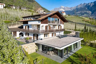 an aerial view of a house in the mountains at Ferienappartement Freiblick in Marlengo
