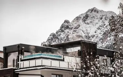 a swimming pool with a view of mountains at Stoa - Elegant & Romantic Guest House - 