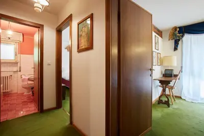 a hallway with a door leading to a room at Lioda Castle in Cortina dʼAmpezzo