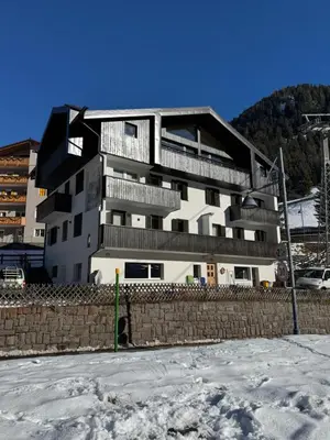 a building with balconies on it in the snow at Cesa Balzan in Canazei