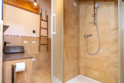 a bathroom with a shower and a sink at Arabba - Al Vecio Soler in Livinallongo del Col di Lana