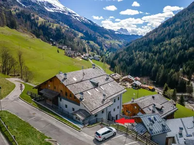 an aerial view of a large house in the mountains at Arabba - Al Vecio Soler in Livinallongo del Col di Lana