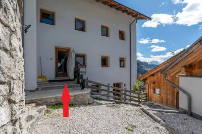 a red arrow is pointing to a house at Arabba - Al Vecio Soler in Livinallongo del Col di Lana