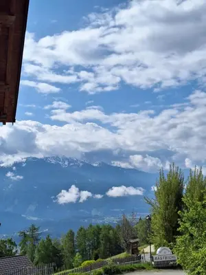 a view of a mountain under a cloudy sky at Residence Rastbichl - Apartments & Indoor-Pool in Maranza