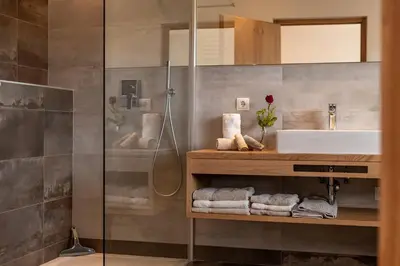 a bathroom with a sink and a toilet at Moosbichlerhof in Marlengo