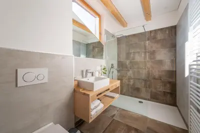 a bathroom with a sink and a mirror at Moosbichlerhof in Marlengo