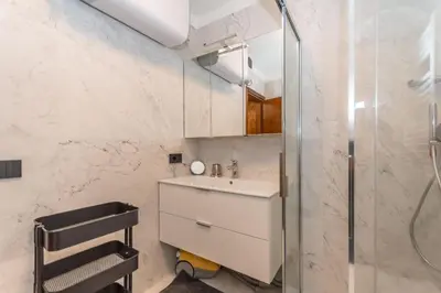 a bathroom with a sink and a shower at Casa Ciadenac in Soraga
