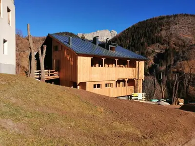 a house sitting on top of a hill at Tabià del Belli in Livinallongo del Col di Lana