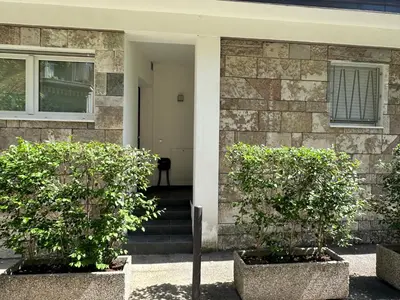 a house with two trees in front of it at Ida s home free WiFi AC in Bolzano