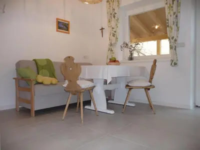 a living room with a couch and chairs and a table at Ferienwohnungen HÖLLERHOF in Terlan in Vilpiano
