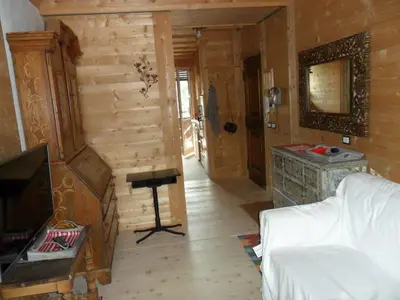 a room with a bed and a tv in a room at Villa 5 Torri in Cortina dʼAmpezzo