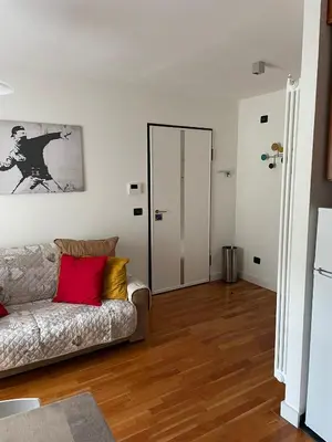a living room with a couch and a door at A casa di Cato in Merano