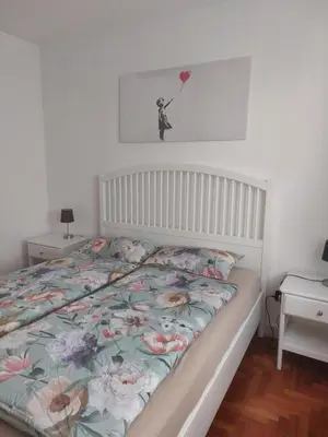 a bedroom with a bed with a bedspread with a heart at A casa di Cato in Merano