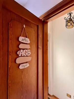 a group of signs on the door of a room at Ciasa AGB in Moena