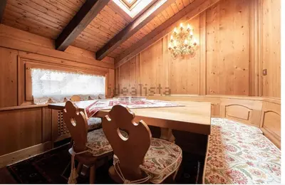 a dining room with a table and two chairs at San vito di Cadore centro - Cortina D'ampezzo in San Vito di Cadore