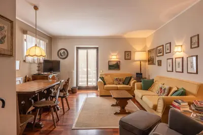 a living room with a couch and a table at Casa Carina in Cortina d Ampezzo in Cortina dʼAmpezzo