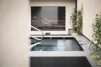 a swimming pool in the middle of a house at Gisse Zwölf in Gais