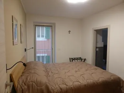 a bedroom with a bed in a room at Casa di Gio in Cavalese