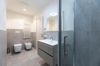 a bathroom with a sink and a toilet at Casa di Gio in Cavalese