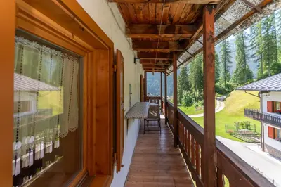 a hallway of a house with large windows at Appartamento Focobon in Falcade