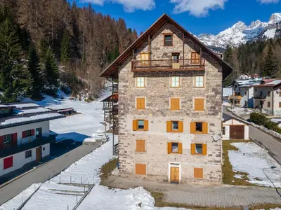 an aerial view of a building with a balcony at Appartamento Focobon in Falcade