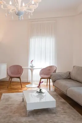 a living room with a couch and a table at Eden House Experience in Merano