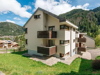 a house with balconies on the side of it at Apartment Mansarda Golfieri by Interhome in Alba di Canazei