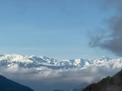 a view of a mountain range with snow covered mountains at Chalet Tschattlhof Dolomites in Ponte Nova