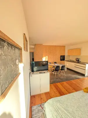 a room with a chalkboard on a wall and a classroom at Appartamento LA REGINA un dolce rifugio tra api e natura in Tret