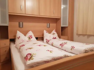 two pillows on a bed in a room at Neuhäusel-Hof Appartments in Avigna