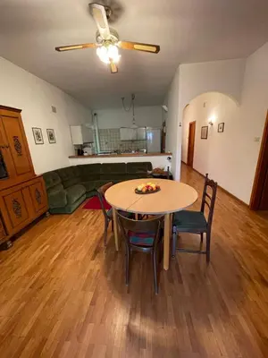a living room with a table and chairs at Casa vacanza predaia in Taio