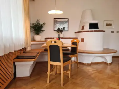a dining room with a table and chairs at Urlaub auf dem Bauernhof Schmidhof - große Terrasse, Pool und beste Lage in Caldaro