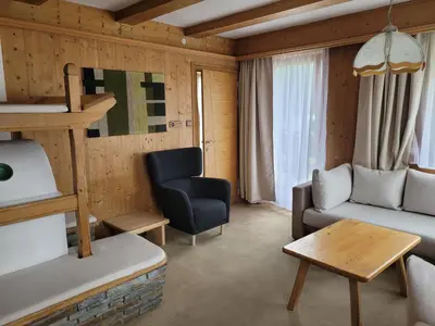 a living room with a bunk bed and a couch at Ferienwohnung Pfitschtal in San Giacomo Val di Vizze